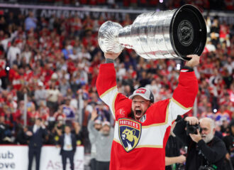 2024 Stanley Cup Final - Game Seven SUNRISE, FLORIDA - JUNE 24: Kyle Okposo #8 of the Florida Panthers hoists the Stanley Cup after Florida's 2-1 victory against the Edmonton Oilers in Game Seven of the 2024 Stanley Cup Final at Amerant Bank Arena on June 24, 2024 in Sunrise, Florida. (Photo by Carmen Mandato/Getty Images)